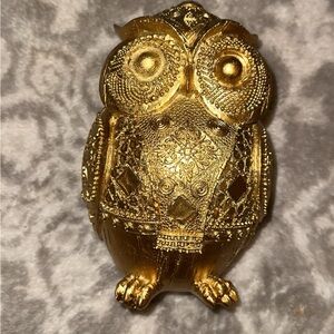 Very cute ceramic golden owl bank. New in the box.